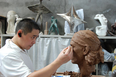 Shen Xiaonan working on the clay bust of top tennis player Rafael Nadal for the Terracotta Warriors of Tennis in his Tank Loft Contemporary Arts Center studio, adjacent to the Sichuan Fine Arts Institute in Chongqing