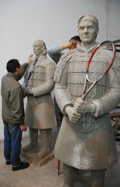 Chinese sculptor Shen Xioanan working on the resin statues of the first two tennis terracotta warrior sculptures